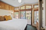 Large master bedroom with tall windows for natural light